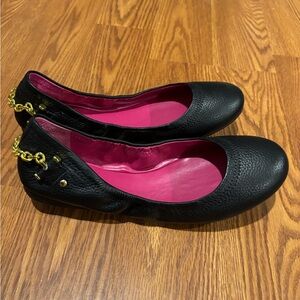 Brand New Black Ralph Lauren flats with gold embellishment on the back